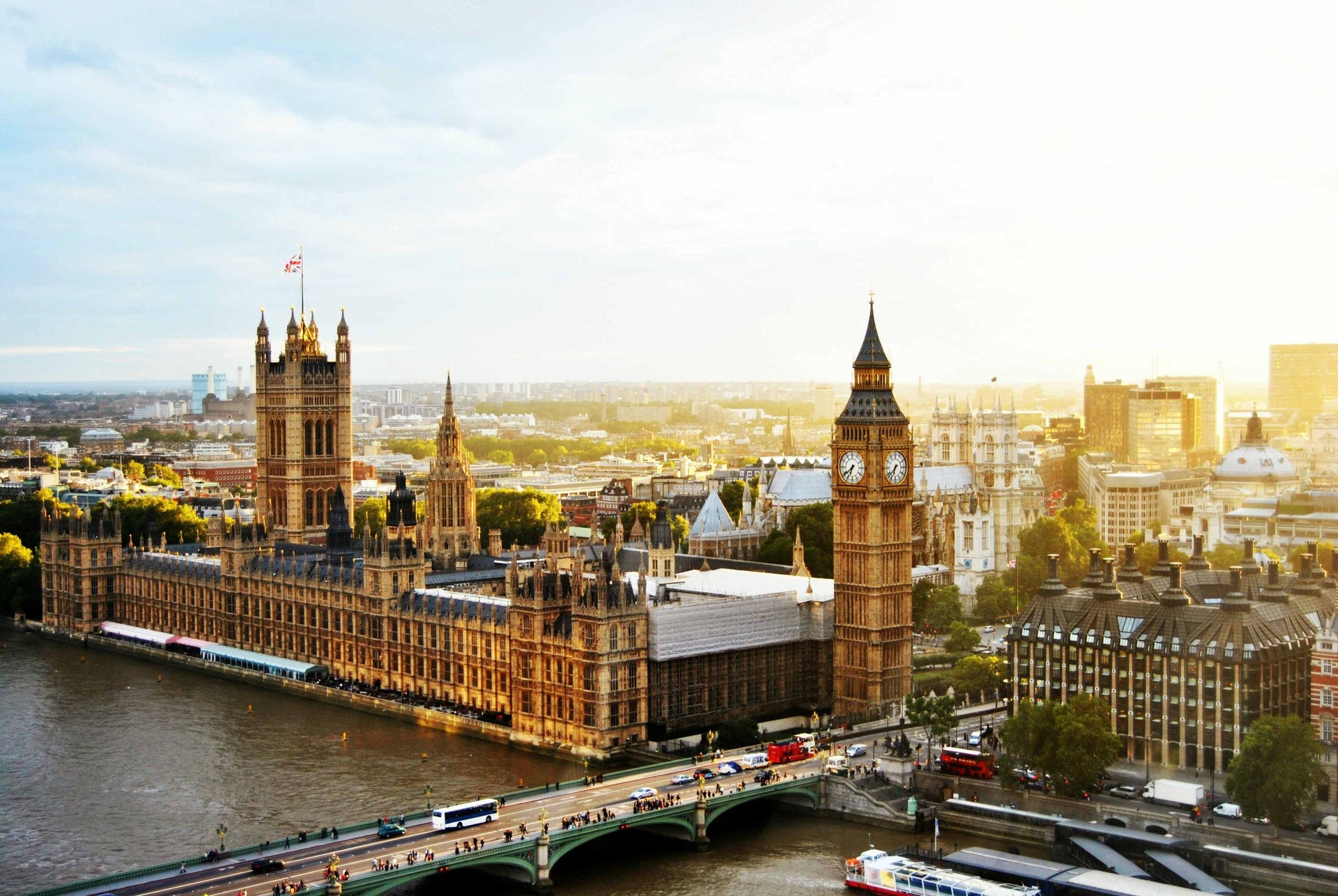 The Palace of Westminster rises above the River Thames with the London skyline in the background