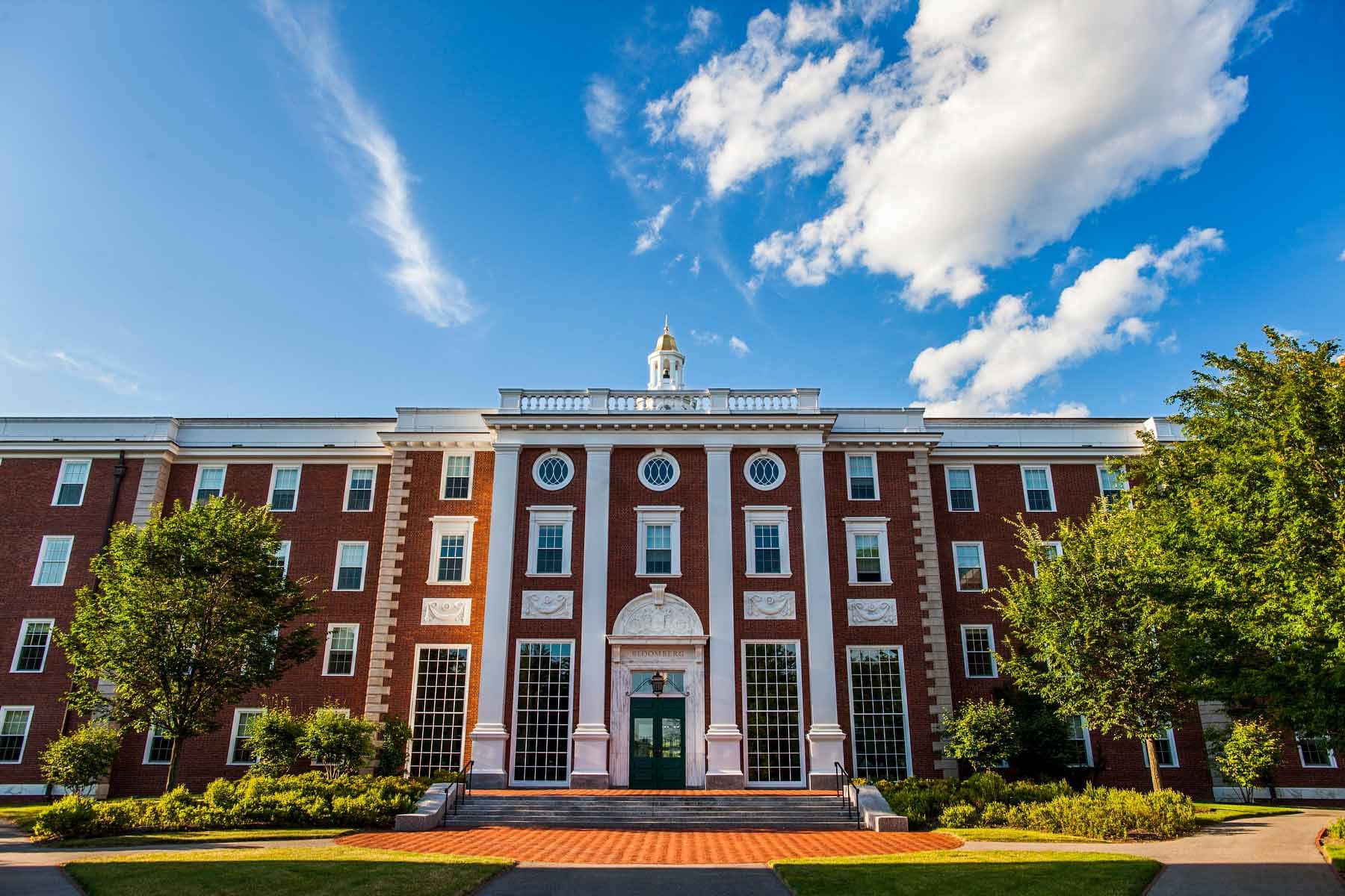 Many windows and the gold-tipped spire of Baker Library at Harvard University