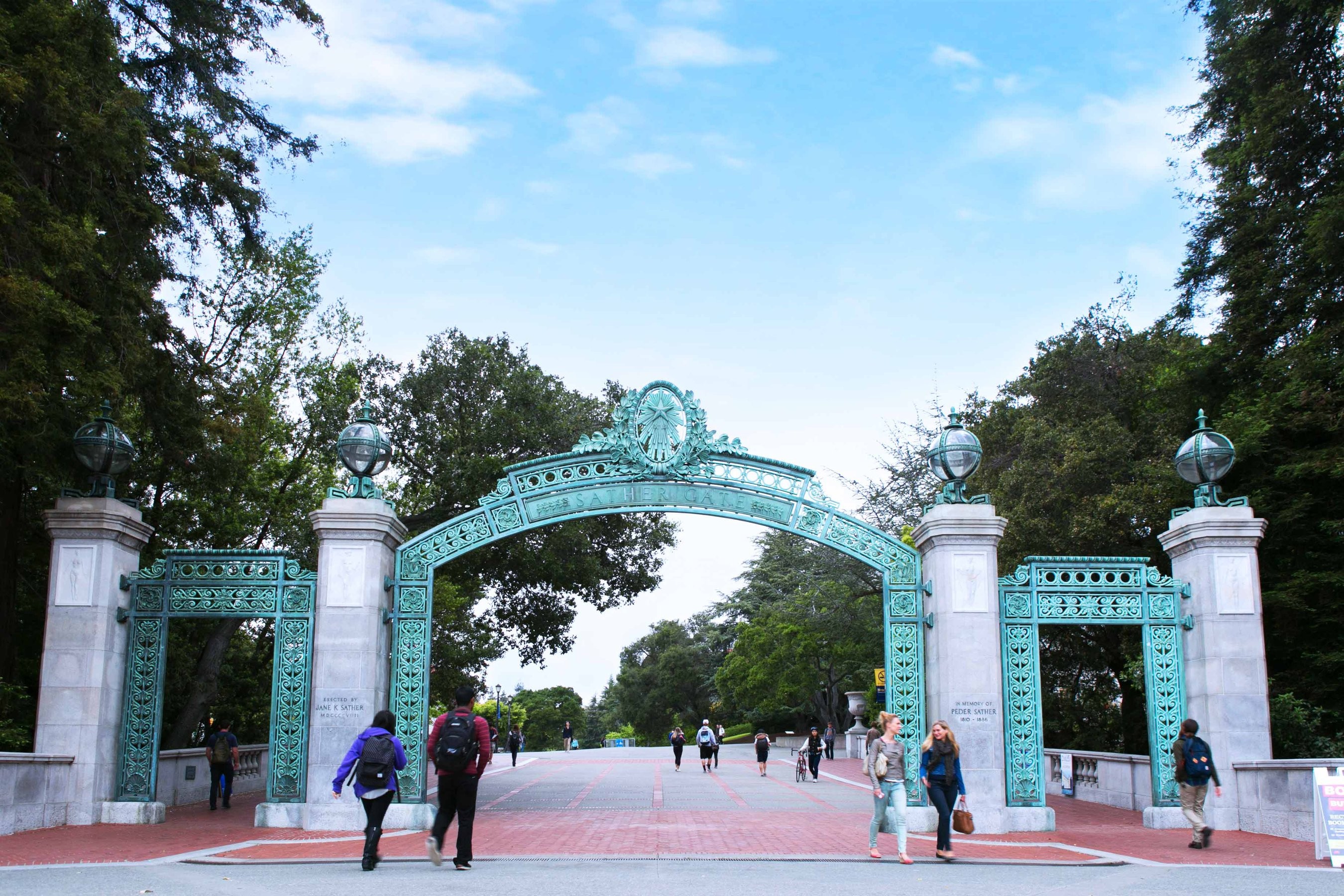 UC Berkeley students walking underneath the Sather Gate